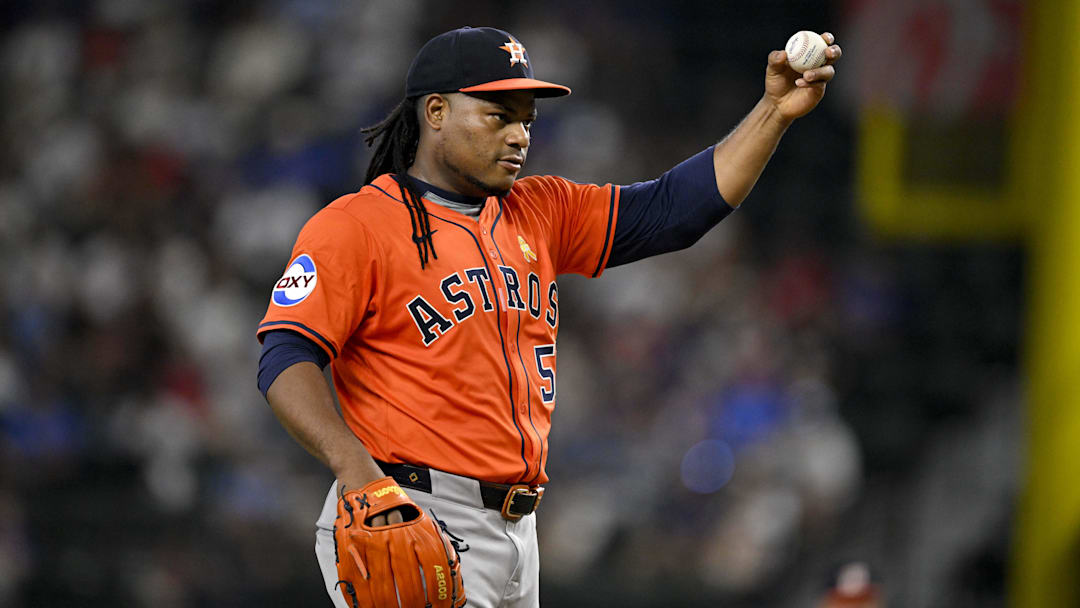 Sep 7, 2025; Arlington, Texas, USA; Houston Astros starting pitcher Framber Valdez (59) motions for a new ball during the sixth inning against the Texas Rangers at Globe Life Field. Mandatory Credit: Jerome Miron-Imagn Images