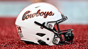 Nov 18, 2023; Houston, Texas, USA; A detailed view of an Oklahoma State Cowboys helmet on the sideline of the game against the Houston Cougars at TDECU Stadium. Mandatory Credit: Maria Lysaker-Imagn Images