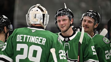 Oct 15, 2024; Dallas, Texas, USA; Dallas Stars goaltender Jake Oettinger (29) and defenseman Thomas Harley (55) and center Roope Hintz (24) celebrate the Stars victory over the San Jose Sharks at the American Airlines Center. Mandatory Credit: Jerome Miron-Imagn Images