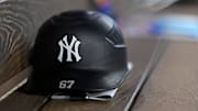 Aug 4, 2025; Arlington, Texas, USA; A view of a New York Yankees helmet and logo before the game between the Texas Rangers and the New York Yankees at Globe Life Field. Mandatory Credit: Jerome Miron-Imagn Images