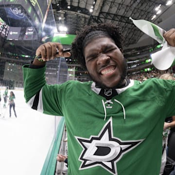 Dallas Cowboys 2025 first round pick Tyler Booker poses for a photo during the first period between the Dallas Stars and the Winnipeg Jets.