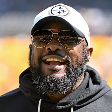 Steelers coach Mike Tomlin stands on the field before a game against the Seahawks at Acrisure Stadium. 