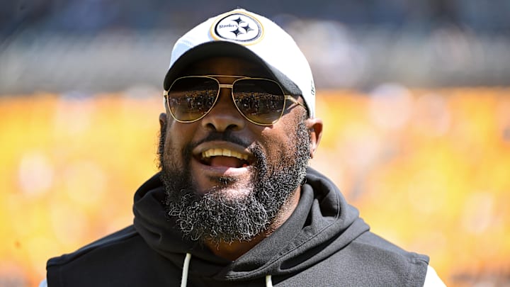 Steelers coach Mike Tomlin stands on the field before a game against the Seahawks at Acrisure Stadium. 