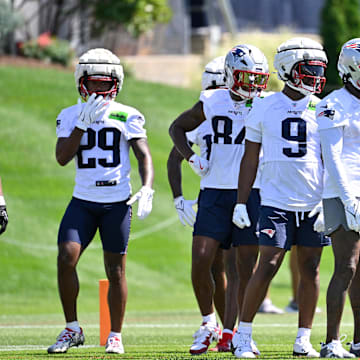 Jul 23, 2025; Foxborough, MA, USA; New England Patriots wide receiver Jeremiah Webb (29), wide receiver Kendrick Bourne (84), wide receiver Kayshon Boutte (9), wide receiver Stefon Diggs (8) and wide receiver DeMario Douglas (3) work with the coaching staff to do a drill during training camp at Gillette Stadium. Mandatory Credit: Eric Canha-Imagn Images