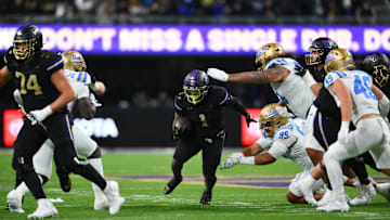 Nov 15, 2024; Seattle, Washington, USA; Washington Huskies running back Jonah Coleman (1) carries the ball against the UCLA Bruins during the second half at Alaska Airlines Field at Husky Stadium. Mandatory Credit: Steven Bisig-Imagn Images