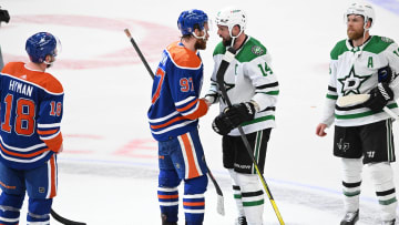 Jun 2, 2024; Edmonton, Alberta, CAN; Oilers centre Connor McDavid (97) shakes hands with Dallas Stars left winger Jamie Benn (14) at the end of the third period in game six of the Western Conference Final of the 2024 Stanley Cup Playoffs at Rogers Place. Mandatory Credit: Walter Tychnowicz-USA TODAY Sports