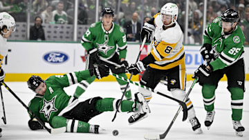 Mar 22, 2024; Dallas, Texas, USA; Dallas Stars center Tyler Seguin (91) is tripped up in front of center Matt Duchene (95) and Pittsburgh Penguins left wing Michael Bunting (8) during the third period at the American Airlines Center. Mandatory Credit: Jerome Miron-Imagn Images