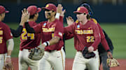May 31, 2025; Corvallis, OR, USA; USC pitcher Caden Hunter (22) high-fives teammates after a game against Saint Mary's at the NCAA Corvallis Regional at Goss Stadium. Mandatory Credit: Troy Wayrynen-Imagn Images