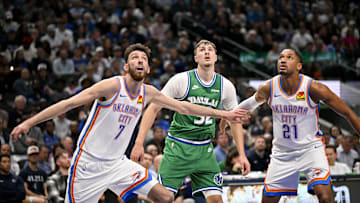 Oct 27, 2025; Dallas, Texas, USA; Oklahoma City Thunder center Chet Holmgren (7) and guard Aaron Wiggins (21) and Dallas Mavericks forward Cooper Flagg (32) look for the ball during the game between the Mavericks and the Thunder at the American Airlines Center. Mandatory Credit: Jerome Miron-Imagn Images
