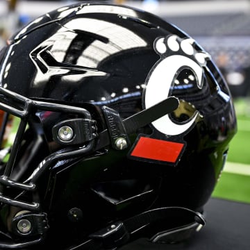 Jul 12, 2023; Arlington, TX, USA; A view of the Cincinnati Bearcats helmet and logo during Big 12 football media day at AT&T Stadium. Mandatory Credit: Jerome Miron-USA TODAY Sports