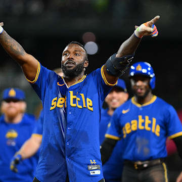 Sep 14, 2024; Seattle, Washington, USA; Seattle Mariners designated hitter Randy Arozarena (56) celebrates after hitting a walk-off single against the Texas Rangers during the ninth inning at T-Mobile Park. Mandatory Credit: Steven Bisig-Imagn Images