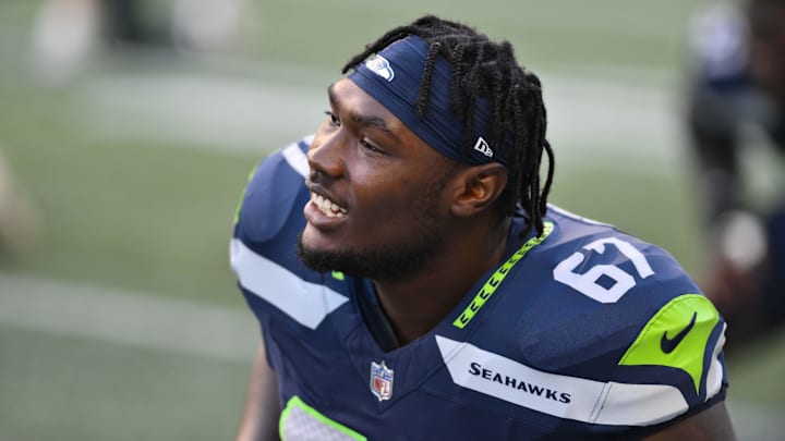 Aug 10, 2023; Seattle, Washington, USA; Seattle Seahawks offensive tackle Charles Cross (67) during warmups prior to the game at Lumen Field. Mandatory Credit: Steven Bisig-Imagn Images