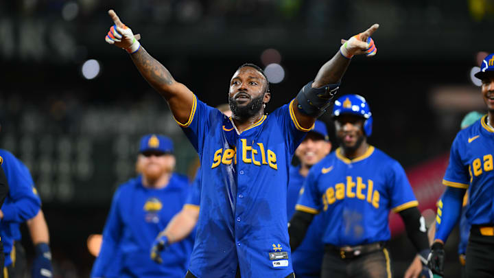 Sep 14, 2024; Seattle, Washington, USA; Seattle Mariners designated hitter Randy Arozarena (56) celebrates after hitting a walk-off single against the Texas Rangers during the ninth inning at T-Mobile Park. Mandatory Credit: Steven Bisig-Imagn Images