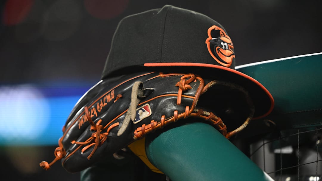 May 8, 2024; Washington, District of Columbia, USA; A Baltimore Orioles hat and glove rest on the dugout rail during a game against the Washington Nationals at Nationals Park. Rafael Suanes-Imagn Images May 8, 2024; Washington, District of Columbia, USA; A Baltimore Orioles hat and glove rest on the dugout rail during a game against the Washington Nationals at Nationals Park. Rafael Suanes-Imagn Images
