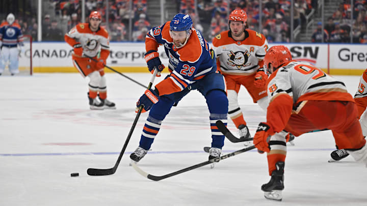 Apr 20, 2026; Edmonton, Alberta, CAN; Edmonton Oilers center Leon Draisaitl (29) and Anaheim Ducks defenseman Pavel Mintyukov (98) battle for the puck in game one of the first round of the 2026 Stanley Cup Playoffs during the third period at Rogers Place. Mandatory Credit: Walter Tychnowicz-Imagn Images
