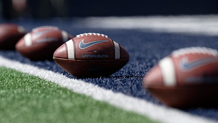 Sep 14, 2024; Logan, Utah, USA;  A general view of NCAA footballs lined up before a game.