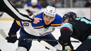 Apr 12, 2025; Seattle, Washington, USA; St. Louis Blues center Robert Thomas (18) waits for the puck to drop during a face off in the first period against the Seattle Kraken at Climate Pledge Arena. Mandatory Credit: Steven Bisig-Imagn Images