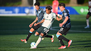 Portland Timbers midfielder Joao Ortiz (80) plays the ball while defended by Tacoma Defiance midfielder Peter Kingston (45) and defender Antino Lopez (35) during the first half at Starfire Sports Complex 