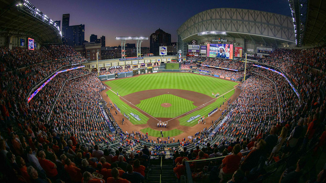 A view of the ballpark, the field, and the sunset during the playing of the national anthem before a World Series game. A view of the ballpark, the field, and the sunset during the playing of the national anthem before a World Series game.