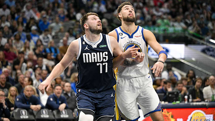 Dallas Mavericks guard Luka Doncic (77) and Golden State Warriors guard Klay Thompson (11) in action during the game between the Dallas Mavericks and the Golden State Warriors at the American Airlines Center. Mandatory Credit: Jerome Miron-Imagn Images