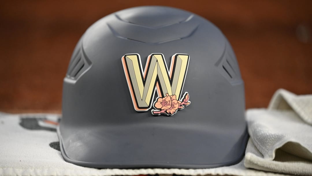 Aug 2, 2024; Washington, District of Columbia, USA; a Washington Nationals batting helmet sits on the ledge in the dugout during a game against the Milwaukee Brewers during the fifth inning at Nationals Park. 