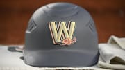 Aug 2, 2024; Washington, District of Columbia, USA; a Washington Nationals batting helmet sits on the ledge in the dugout during a game against the Milwaukee Brewers during the fifth inning at Nationals Park. 