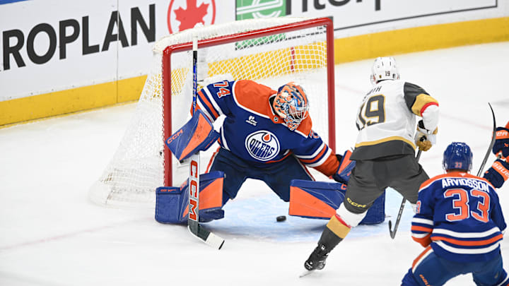 May 10, 2025; Edmonton, Alberta, CAN : Edmonton Oilers goalie Stuart Skinner (74) looks for the puck as Las Vegas Golden Knights  right winger Reilly Smith (19) shoots the puck towards him during the first period in game three of the second round of the 2025 Stanley Cup Playoffs at Rogers Place. Mandatory Credit: Walter Tychnowicz-Imagn Images