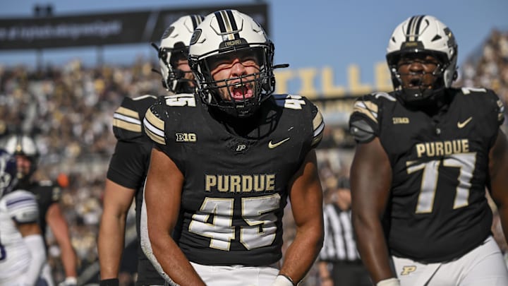 Nov 2, 2024; West Lafayette, Indiana, USA; Purdue Boilermakers running back Devin Mockobee (45) celebrates a touchdown during the second half against the Northwestern Wildcats at Ross-Ade Stadium. Mandatory Credit: Marc Lebryk-Imagn Images