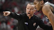 Jan 28, 2025; Louisville, Kentucky, USA;  Louisville Cardinals head coach Pat Kelsey talks with center Frank Anselem-Ibe (13) during the second half against the Wake Forest Demon Deacons at KFC Yum! Center. Louisville defeated Wake Forest 72-59. Mandatory Credit: Jamie Rhodes-Imagn Images