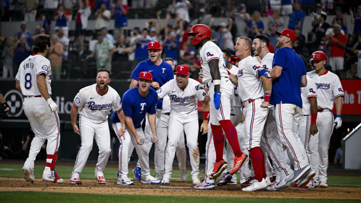 Aug 5, 2024; Arlington, Texas, USA; Texas Rangers left fielder Josh Smith (8) celebrates with his teammates after he hits the game winning walk-off home run against the Houston Astros during the tenth inning at Globe Life Field. Mandatory Credit: Jerome Miron-USA TODAY Sports