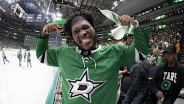 May 11, 2025; Dallas, Texas, USA; Dallas Cowboys 2025 first round pick Tyler Booker poses for a photo during the first period between the Dallas Stars and the Winnipeg Jets in game three of the second round of the 2025 Stanley Cup Playoffs at American Airlines Center. Mandatory Credit: Jerome Miron-Imagn Images