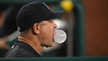 Aug 27, 2024; Washington, District of Columbia, USA; New York Yankees manager Aaron Boone (17) blows a bubble in the dugout against the Washington Nationals during the fourth inning at Nationals Park. Mandatory Credit: Rafael Suanes-USA TODAY Sports