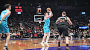 Nov 17, 2025; Toronto, Ontario, CAN;  Charlotte Hornets forward Kon Knueppel (7) shoots the ball against Toronto Raptors center Sandro Mamukelashvili (54) in the second half at Scotiabank Arena. Mandatory Credit: Dan Hamilton-Imagn Images