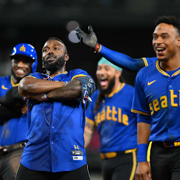 Sep 14, 2024; Seattle, Washington, USA; Seattle Mariners designated hitter Randy Arozarena (56) celebrates after hitting a walk-off single against the Texas Rangers during the ninth inning at T-Mobile Park. Mandatory Credit: Steven Bisig-Imagn Images