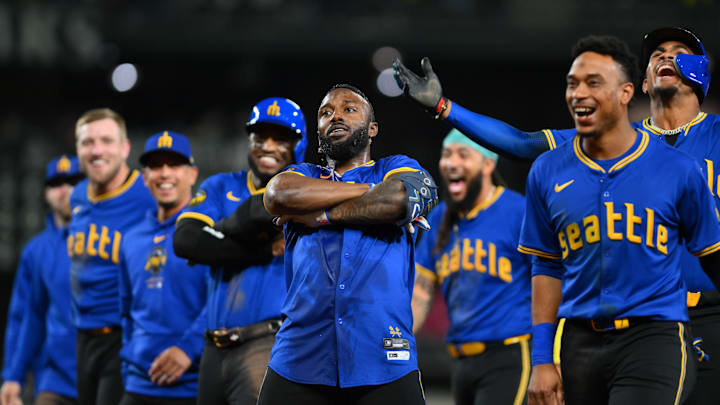 Sep 14, 2024; Seattle, Washington, USA; Seattle Mariners designated hitter Randy Arozarena (56) celebrates after hitting a walk-off single against the Texas Rangers during the ninth inning at T-Mobile Park. Mandatory Credit: Steven Bisig-Imagn Images