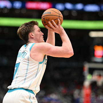 Oct 26, 2025; Washington, District of Columbia, USA; Charlotte Hornets guard Kon Knueppel (7) attempts.a shot against the Washington Wizards during the third quarter at Capital One Arena. Mandatory Credit: Rafael Suanes-Imagn Images