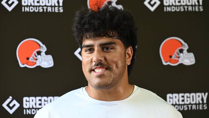 Cleveland Browns offensive tackle Spencer Fano (55) talks to the media.