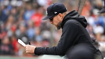 Sep 22, 2024; Boston, Massachusetts, USA; Minnesota Twins manager Rocco Baldelli (5) looks over paperwork during the eighth inning against the Boston Red Sox at Fenway Park.