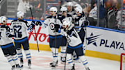 Mar 20, 2025; Edmonton, Alberta, CAN; Winnipeg Jets right winger Nino Niederreiter (62) and Jets left winger Alex Iafolo (9) clebrate their win on the Edmonton Oilers during the overtime period at Rogers Place. Mandatory Credit: Walter Tychnowicz-Imagn Images