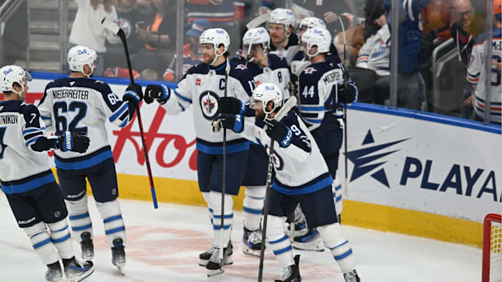 Mar 20, 2025; Edmonton, Alberta, CAN; Winnipeg Jets right winger Nino Niederreiter (62) and Jets left winger Alex Iafolo (9) clebrate their win on the Edmonton Oilers during the overtime period at Rogers Place. Mandatory Credit: Walter Tychnowicz-Imagn Images