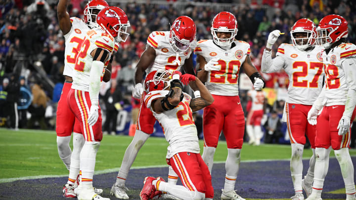 Jan 28, 2024; Baltimore, Maryland, USA; Kansas City Chiefs safety Deon Bush (26) celebrates with teammates after intercepting a pass in the end zone in the second half against the Baltimore Ravens in the AFC Championship football game at M&T Bank Stadium. Mandatory Credit: Tommy Gilligan-USA TODAY Sports