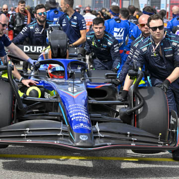 Oct 23, 2022; Austin, Texas, USA; The crew of Williams Racing driver Nicholas Latifi (6) of Team Canada wheel their car onto the grid before the start of the U.S. Grand Prix F1 race at Circuit of the Americas. Mandatory Credit: Jerome Miron-USA TODAY Sports