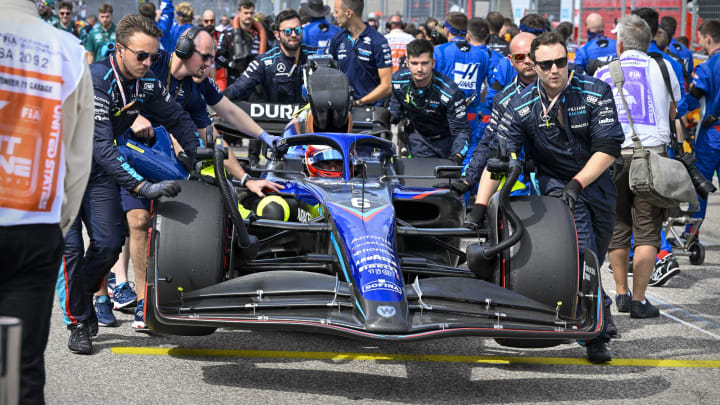 Oct 23, 2022; Austin, Texas, USA; The crew of Williams Racing driver Nicholas Latifi (6) of Team Canada wheel their car onto the grid before the start of the U.S. Grand Prix F1 race at Circuit of the Americas. Mandatory Credit: Jerome Miron-USA TODAY Sports