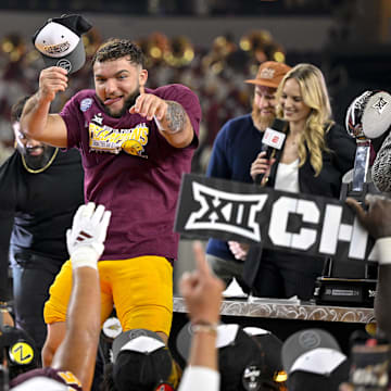 Arizona State Sun Devils running back Cam Skattebo (4) celebrates after the Sun Devils beat Iowa State to win the Big 12 football championship.