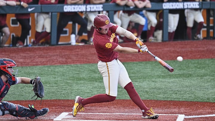 May 31, 2025; Corvallis, OR, USA; USC infielder Ethan Hedges (15) hits the ball in the seventh inning against Saint Mary's at the NCAA Corvallis Regional at Goss Stadium. May 31, 2025; Corvallis, OR, USA; USC infielder Ethan Hedges (15) hits the ball in the seventh inning against Saint Mary's at the NCAA Corvallis Regional at Goss Stadium.