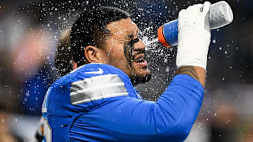 Nov 2, 2025; Detroit, Michigan, USA; Detroit Lions tackle Penei Sewell (58) splashes water on his face during warm-ups before the game against the Minnesota Vikings at Ford Field.