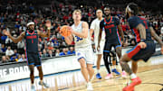 Mar 21, 2024; Omaha, NE, USA; Brigham Young Cougars guard Dallin Hall (30) drives against Duquesne Dukes guard Dae Dae Grant (3) in the second half during the first round of the NCAA Tournament at CHI Health Center Omaha. Mandatory Credit: Steven Branscombe-USA TODAY Sports