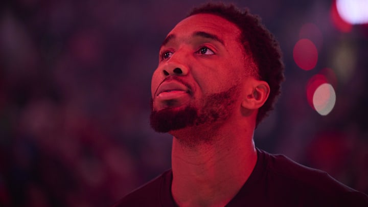 Feb 1, 2026; Portland, Oregon, USA; Cleveland Cavaliers guard Donovan Mitchell (45) stands during the singing of the national anthem before a game against the Portland Trail Blazers at Moda Center. Mandatory Credit: Troy Wayrynen-Imagn Images
