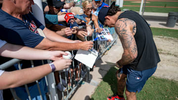Feb 15, 2025; Lee County, FL, USA; Boston Red Sox center fielder Jarren Duran (16) signs autographs for fans  during Spring Training at Jet Blue Park at Fenway South. 