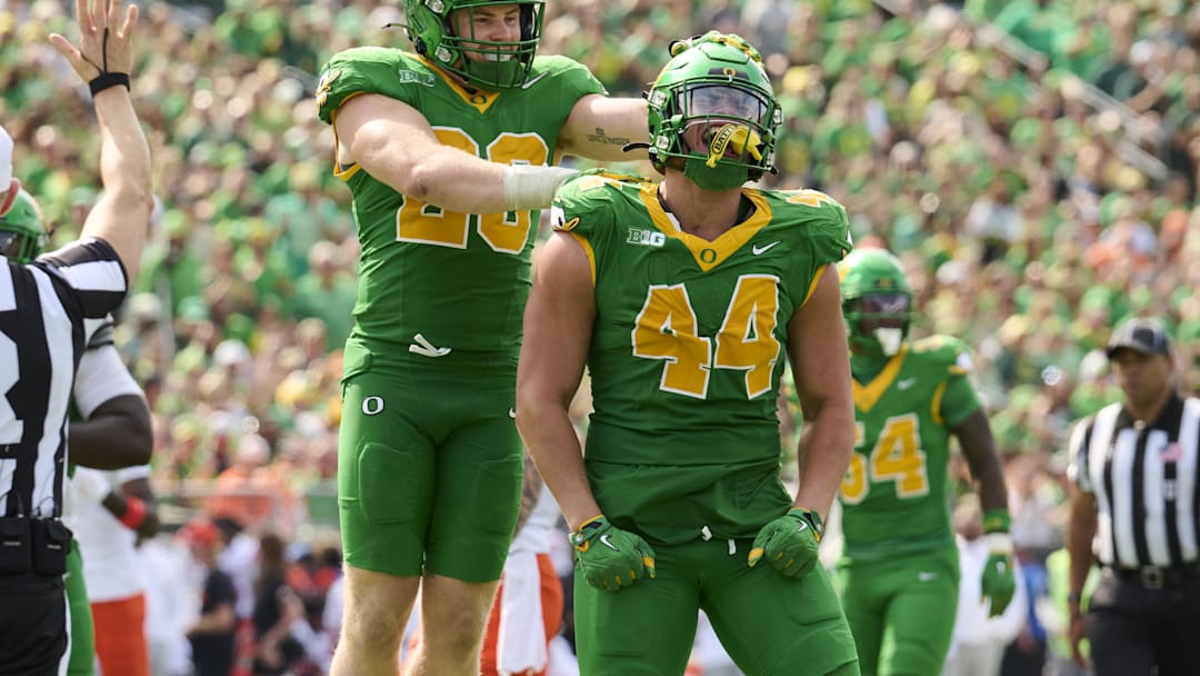 Sep 6, 2025; Eugene, Oregon, USA; Oregon Ducks linebacker Teitum Tuioti (44) celebrates with linebacker Bryce Boettcher (28)